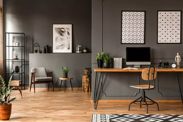 Wooden home office desk in a gray apartment