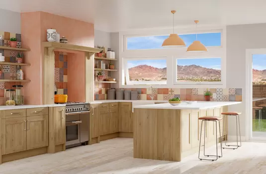 A kitchen with window world casement windows with mountains in the background.