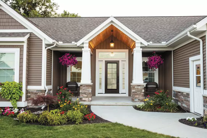 full lite smooth entry door in bronze with internal grids. Full sidelites and a transom in white 