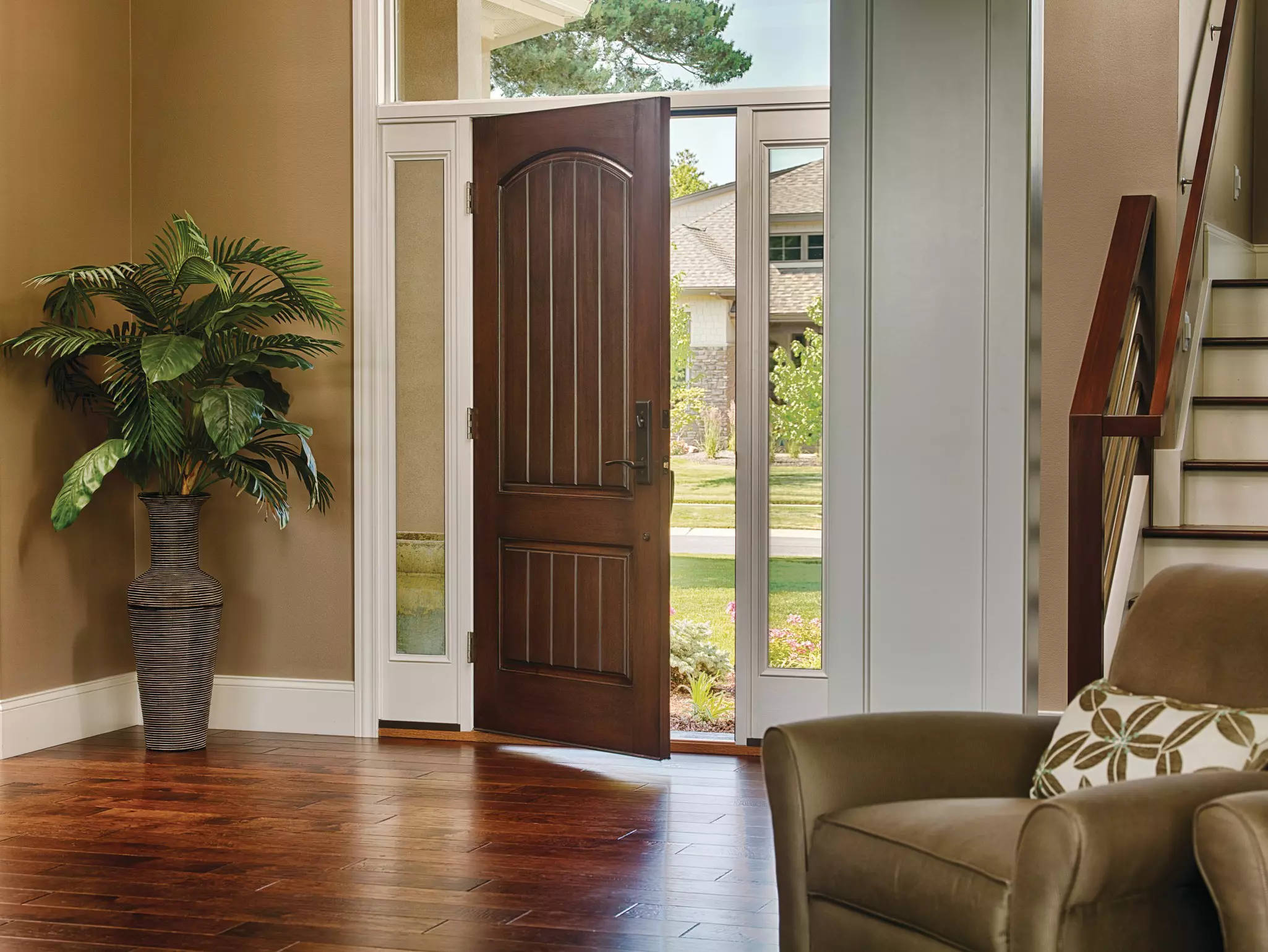 Slightly open brown exterior door with sidelites.