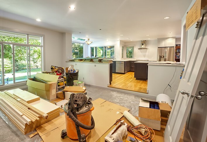 Construction materials amassed inside a house for an upcoming DIY home renovation.