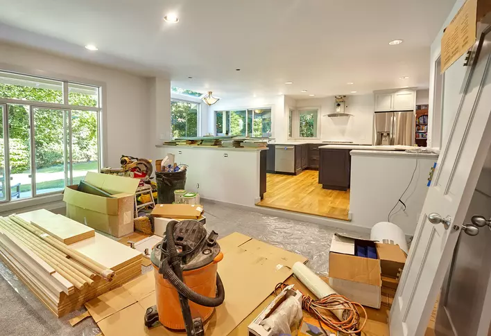 Construction materials amassed inside a house for an upcoming DIY home renovation.