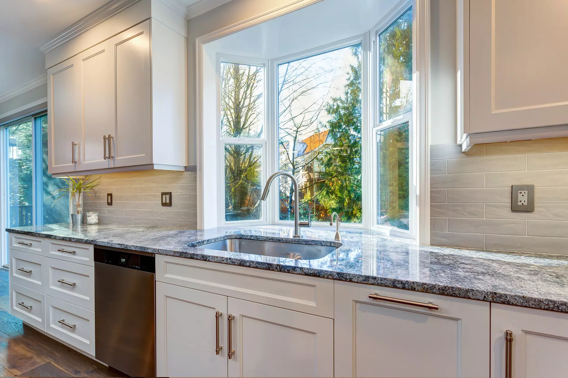 Renovated kitchen sink and countertop with a bay window