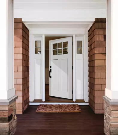 Brushed smooth fiberglass entry door, in a craftsman style with sidelites, prefinished in white