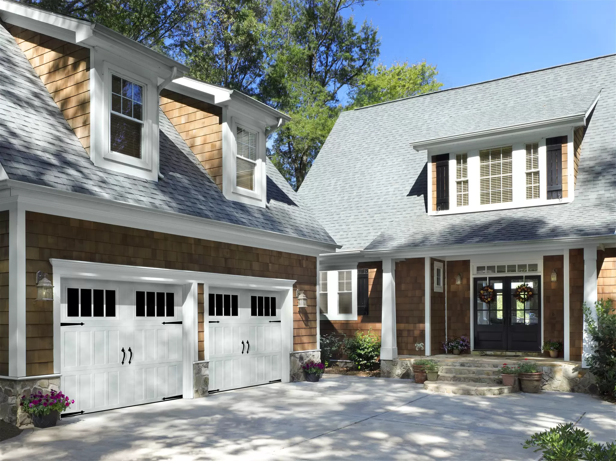 House with detached garage to the left.