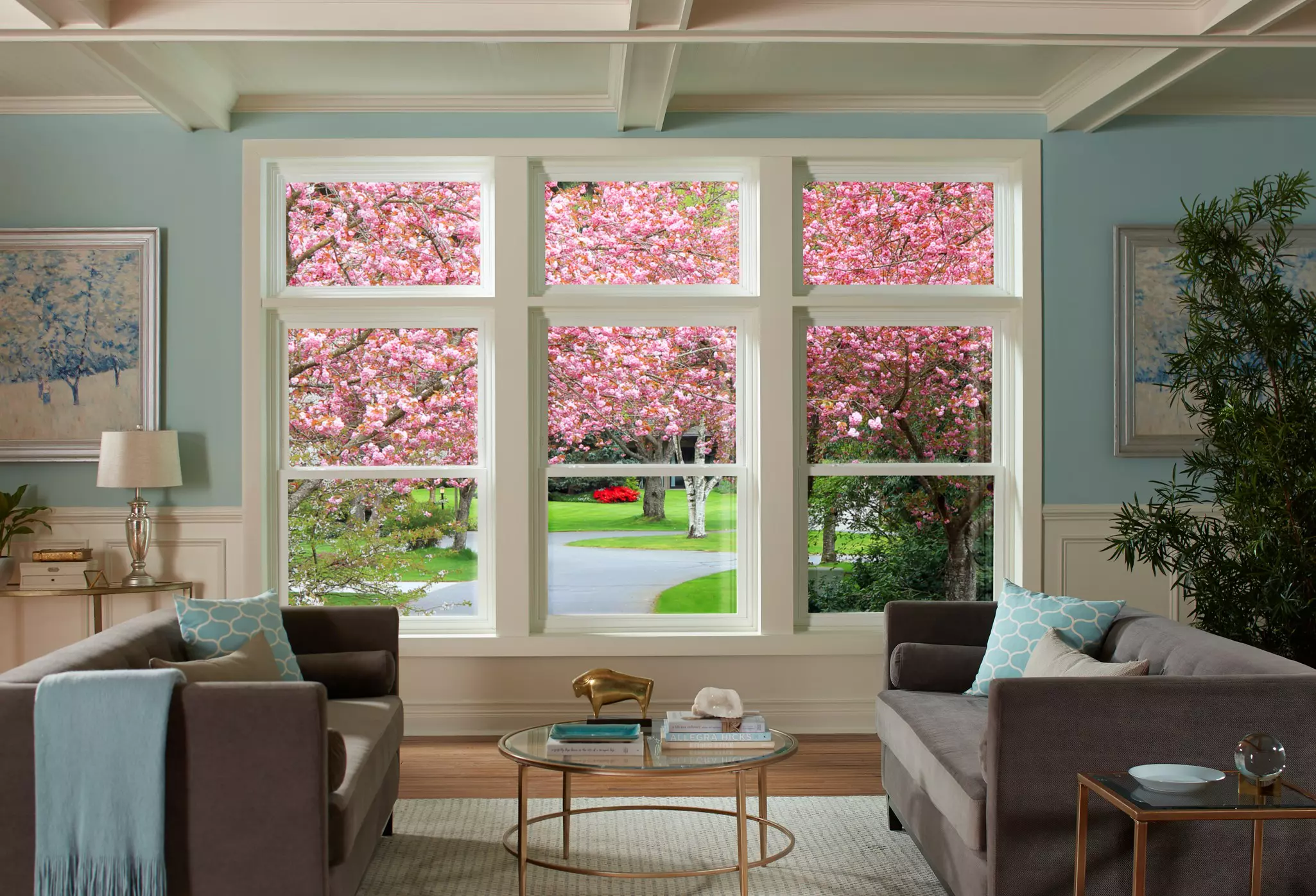 Living room interior with a combination of three double-hung and transom windows.