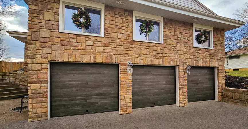 Carbon Oak contemporary residential garage door installed in a suburban family home