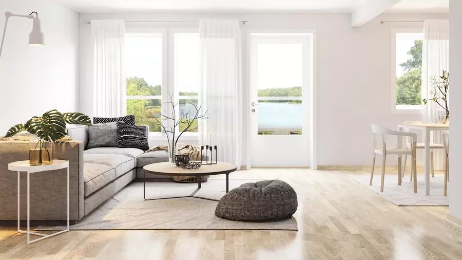 Furnished living room with large sliding windows and a glass patio door