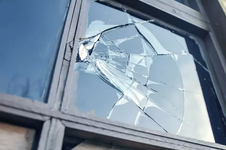 Close-up of broken window glass.