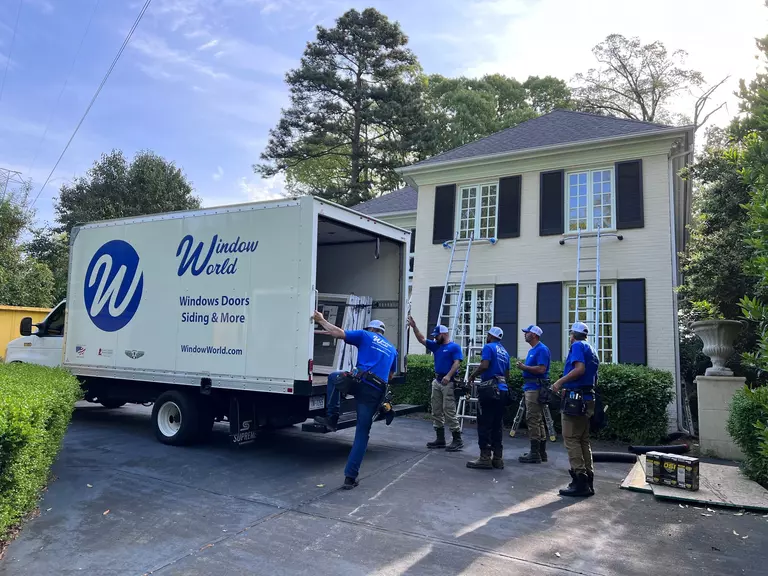Window World installation professionals setting up a remodeling project.