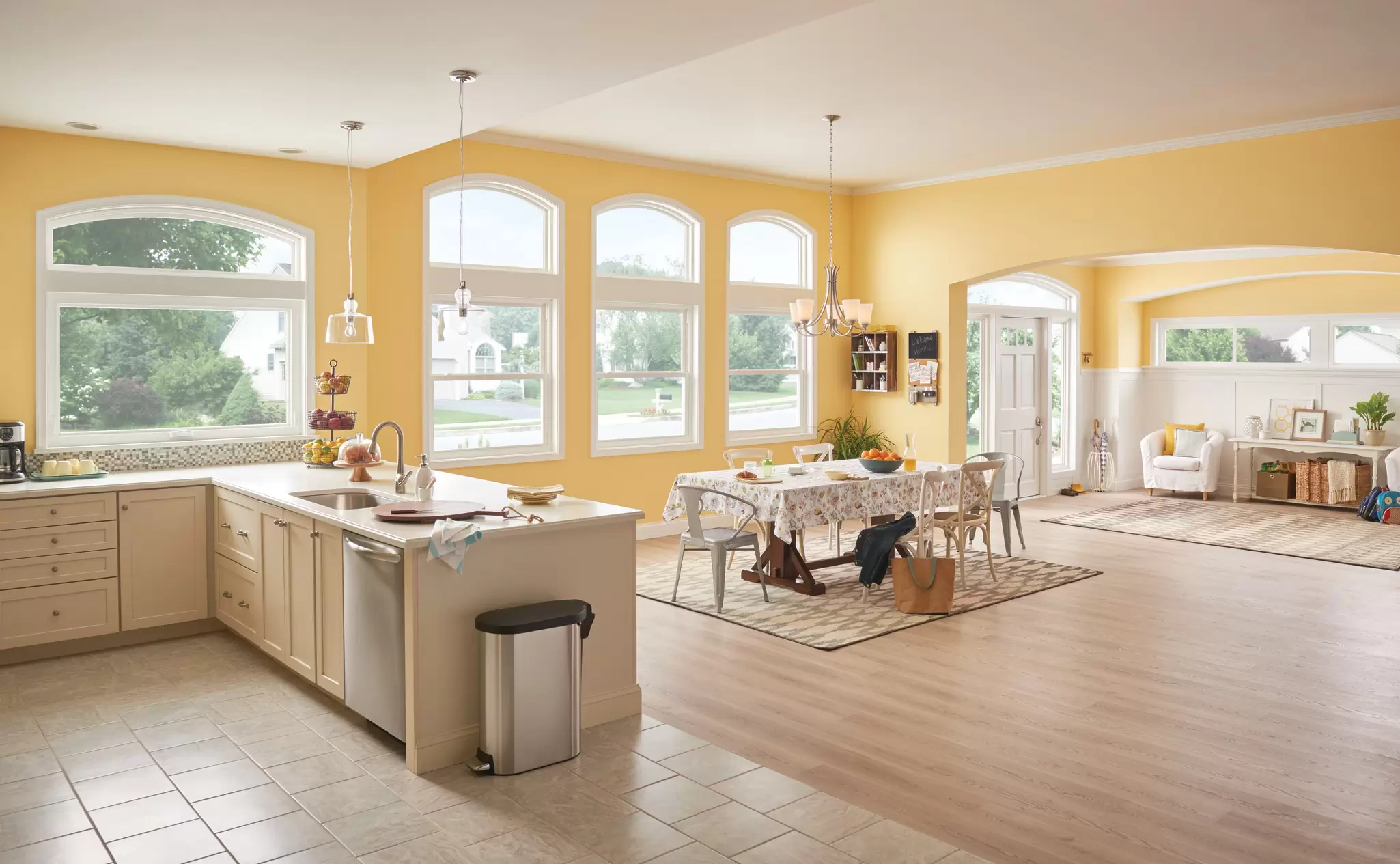 A modern kitchen with multiple styles of windows allowing for natural light.