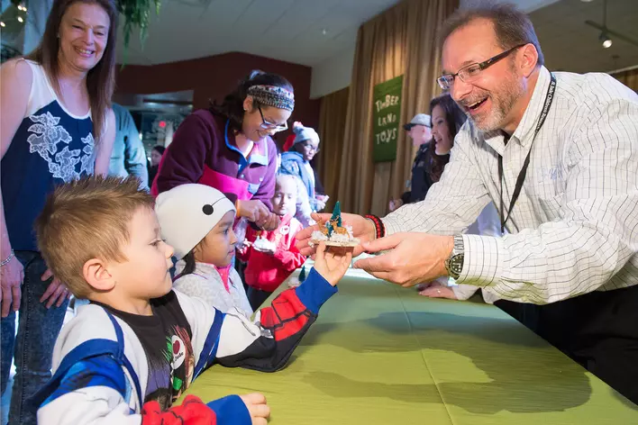 Handing out toys to children at St. Jude Children's Hospital