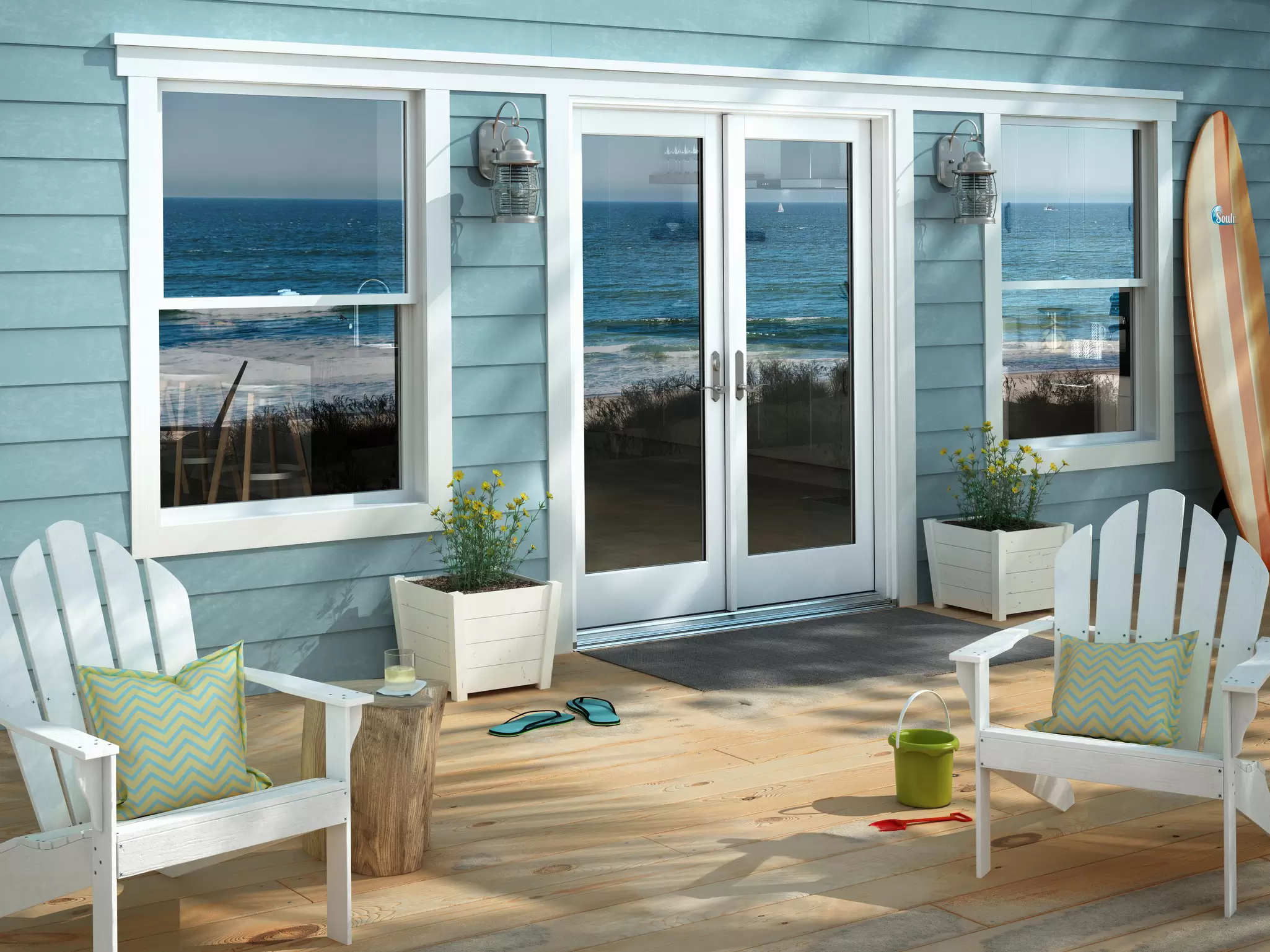 Back porch with white Adirondack chairs, hinged glass patio doors, and windows with a reflection of the ocean and beach.