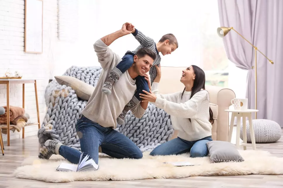 Family In Living Room Window World