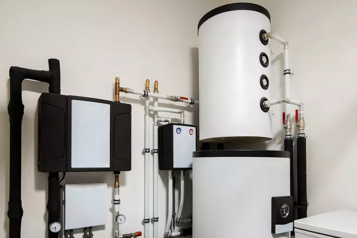 A heat pump water heater in the laundry room of a home to help with overall energy efficiency.