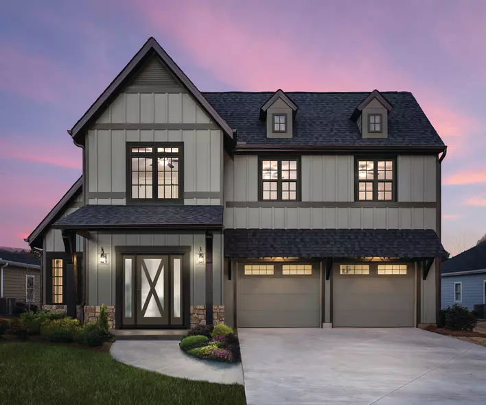 A modern-style home with gray and black exterior coloring with insulated glass windows
all throughout the home.