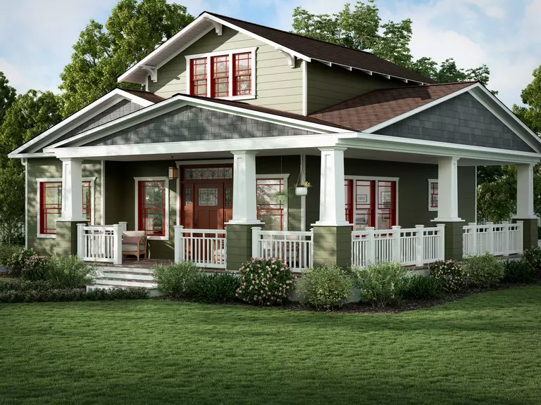 A two-story residential home with light green siding.