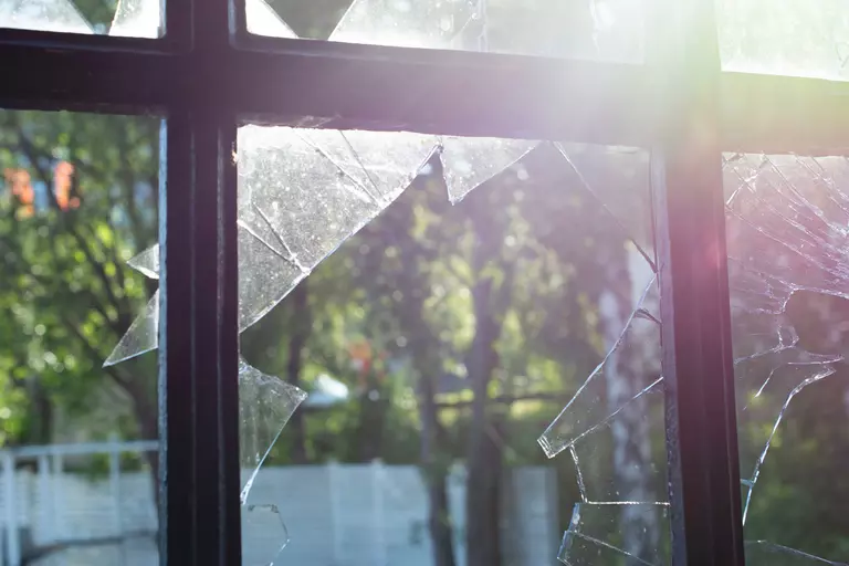 View through broken glass windows.