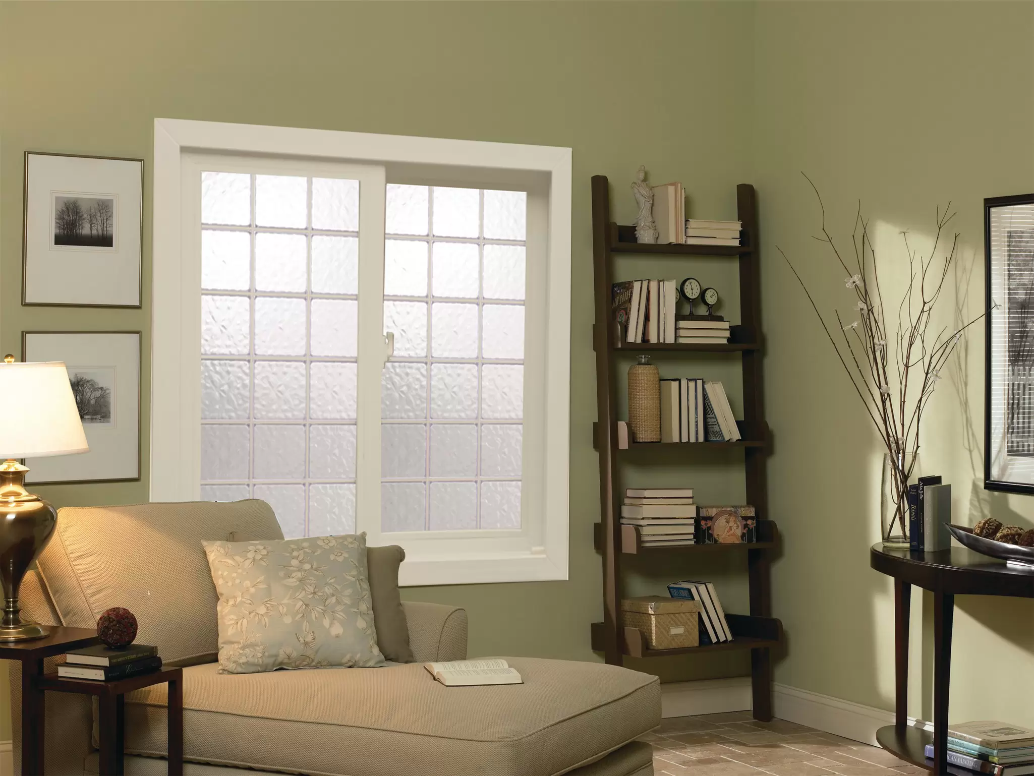 Living room with a sliding acrylic block window.