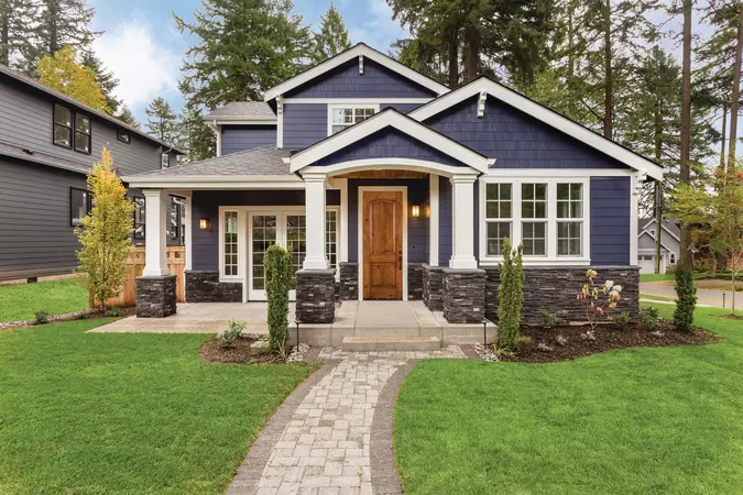 Premium Textured Fiberglass door with a 2-Panel Arch door style, and Addison Handleset hardware in Matte Black.