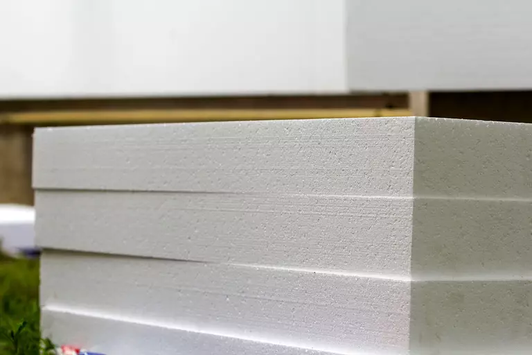 Stack of polyurethane garage door insulation.