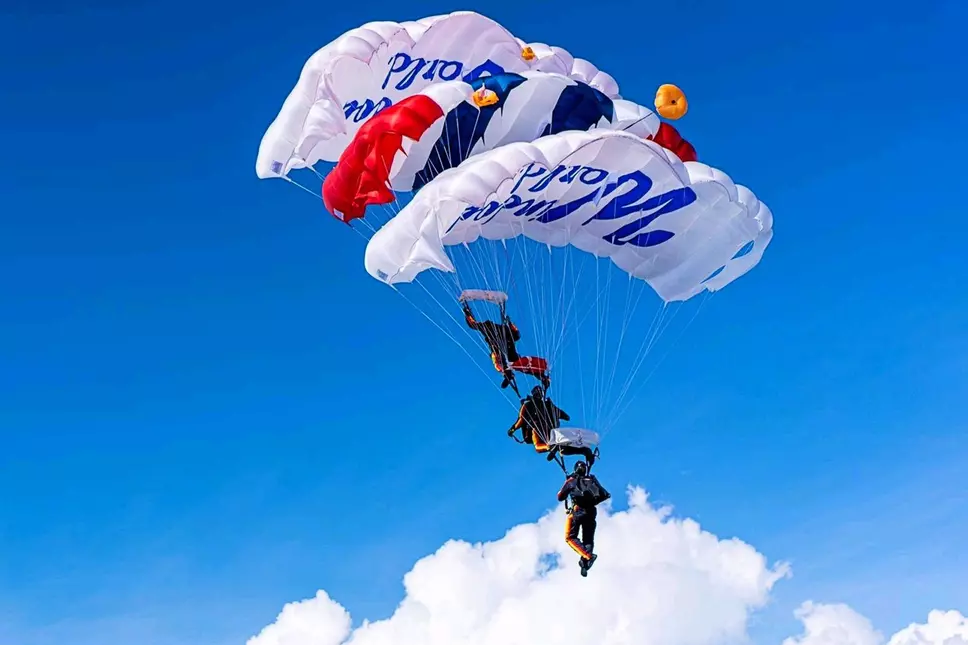 Soldiers parachuting with Window World parachutes