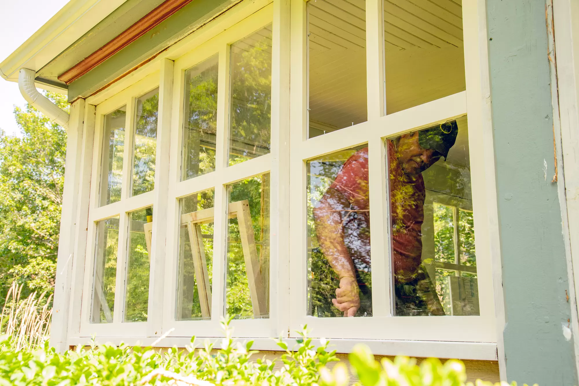 Worker preparing to replace a window.