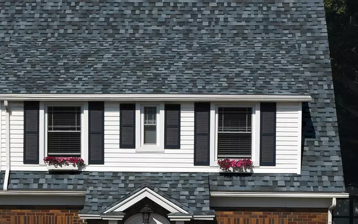 2 story colonial home with Owens Corning's TruDefinition Duration Designer shingle line in the color Pacific Wave