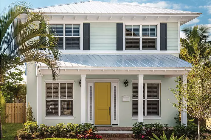 Yellow front door on a beach house