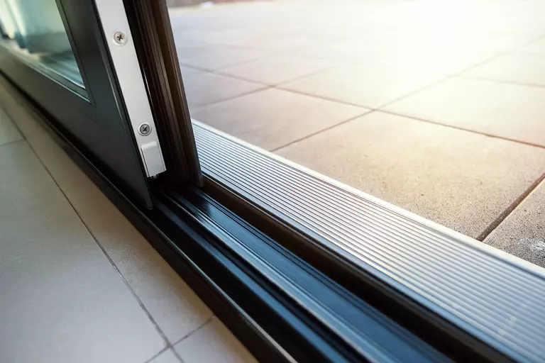 Close-up of a newly installed patio door track.
