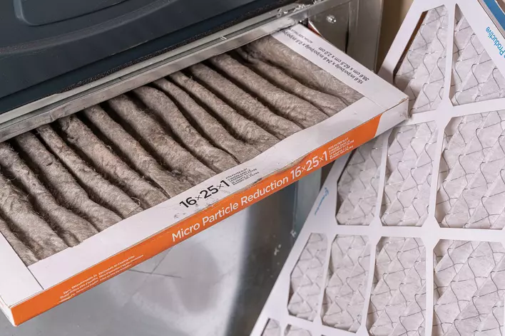 A close-up of a dirty air filter.