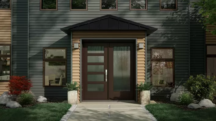 A double-panel, energy-efficient front door on a home with gray siding and neutral tone trim surrounded by greenery and landscaping.